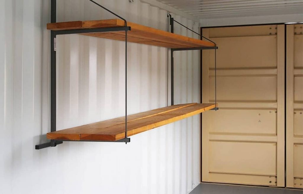 Image of a storage container interior with a shelf on the wall