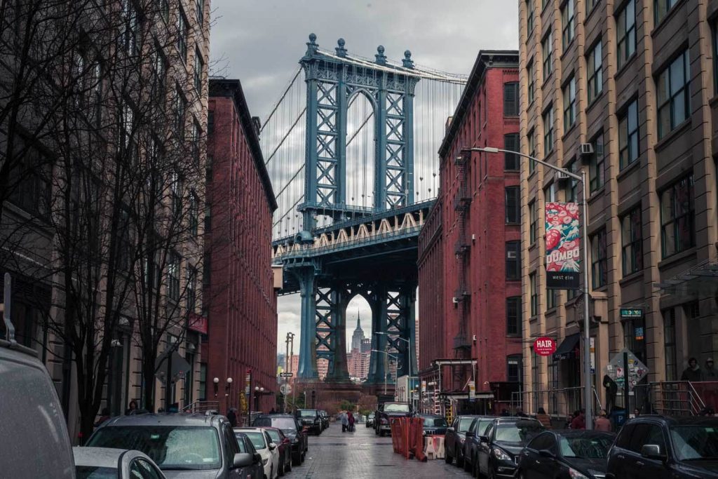 Image of the Brooklyn Bridge from a street in Brooklyn, New York